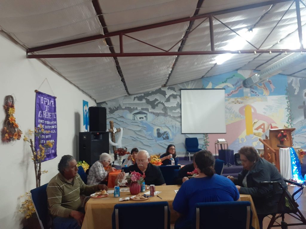 Church members sharing a meal in the fellowship hall
